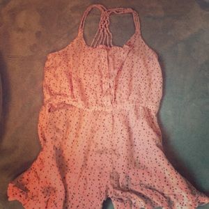 A pink romper with small flowers